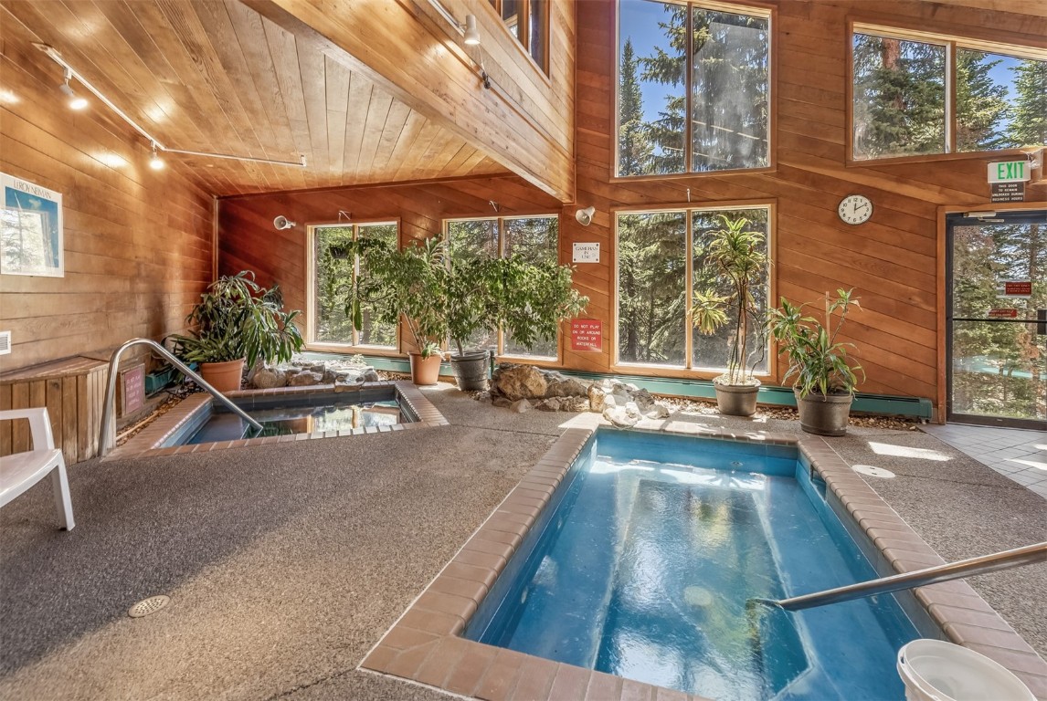 91400 Ryan Gulch Road, Unit 408B Silverthorne, CO 80498 - Photo 18 of 26 a view of a swimming pool with a patio