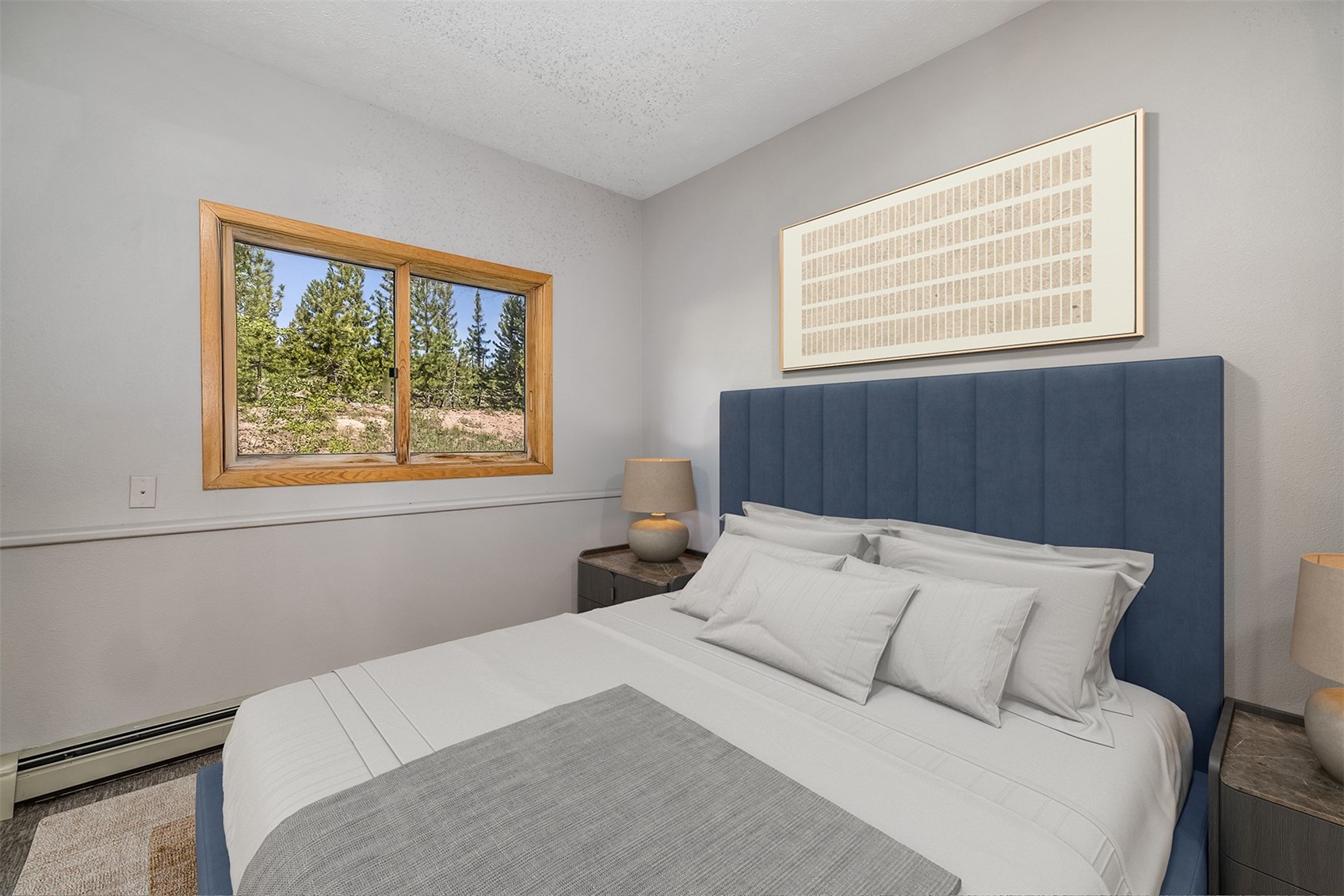 91400 Ryan Gulch Road, Unit 408B Silverthorne, CO 80498 - Photo 6 of 25 a bedroom with a bed and a window