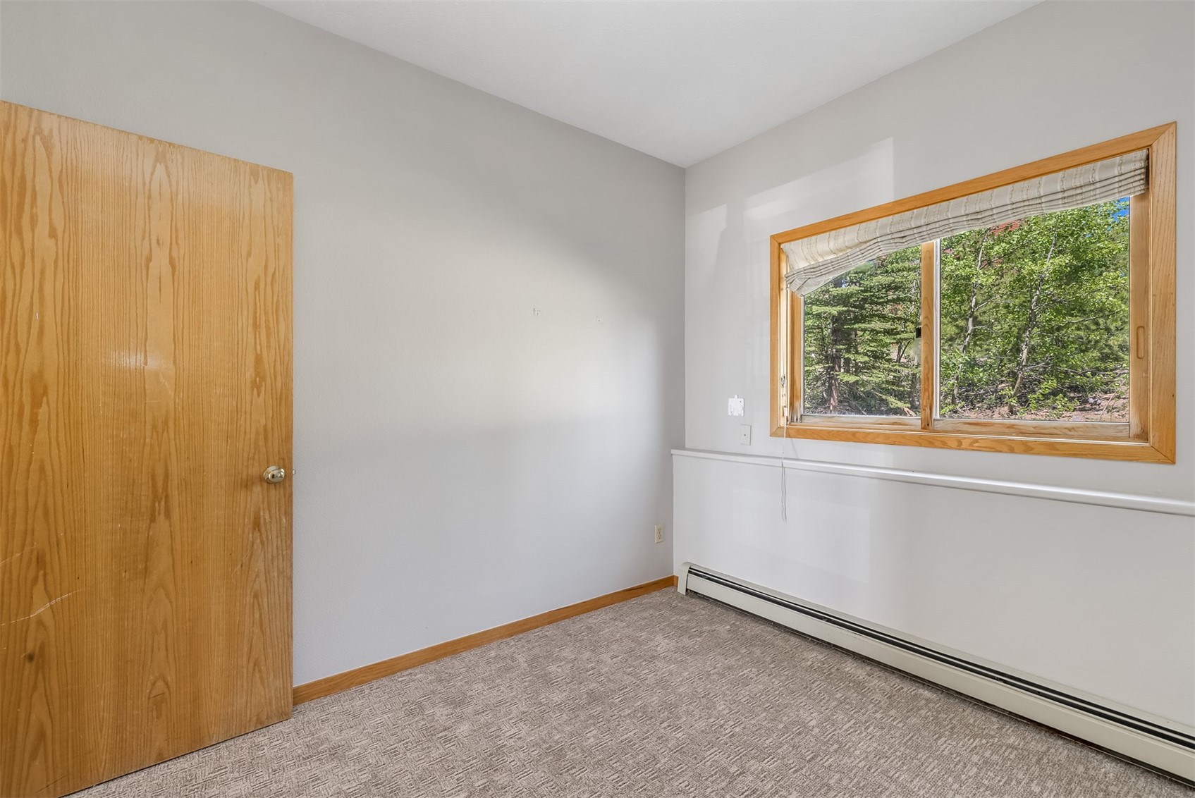 91400 Ryan Gulch Road, Unit 408B Silverthorne, CO 80498 - Photo 8 of 25 a view of an empty room with a window