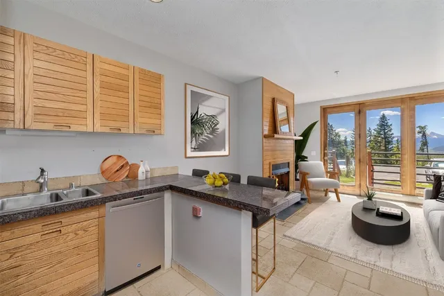 a kitchen with stainless steel appliances granite countertop a sink and a granite counter tops