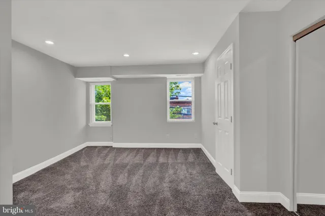 a utility room with closet dryer and washer