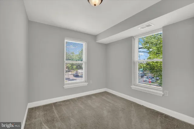 a bathroom with a sink toilet and a mirror