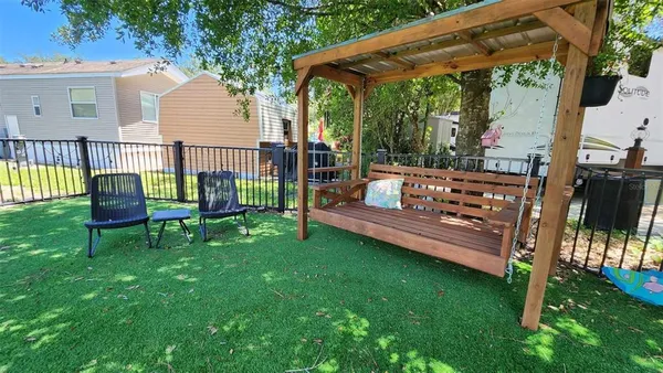 a view of a deck with a table and chairs