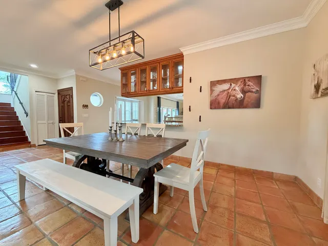 a large kitchen with stainless steel appliances granite countertop a large stove a sink and a granite counter tops