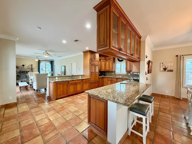a living room with furniture and a lamp