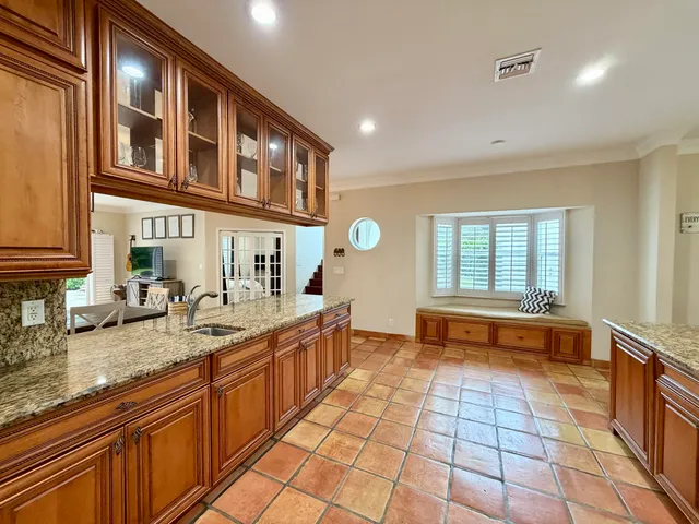 a living room with furniture and a dining table