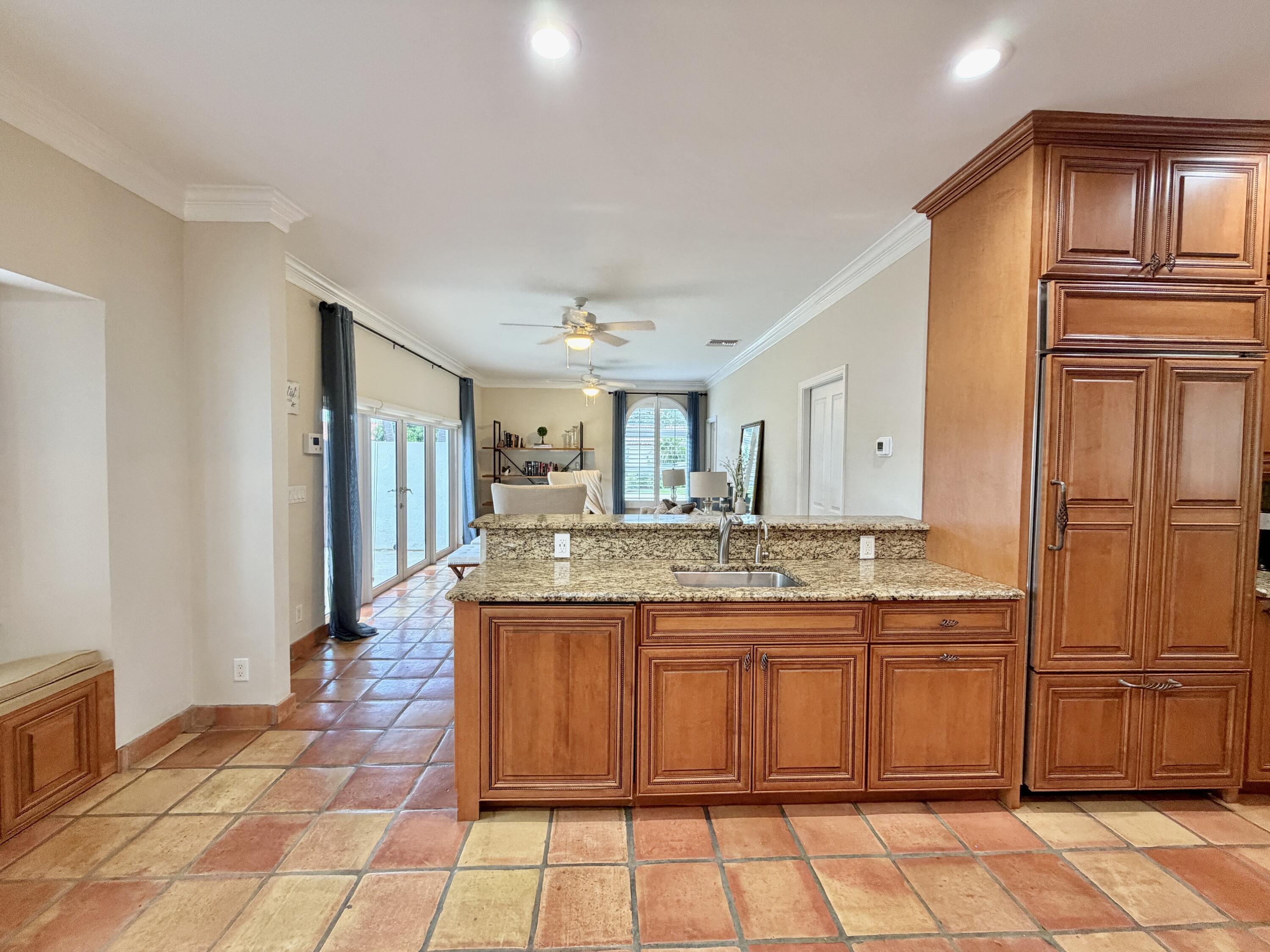 6401 Travis Road West Palm Beach, FL 33406 - Photo 25 of 99 a kitchen with a sink counter top space and appliances
