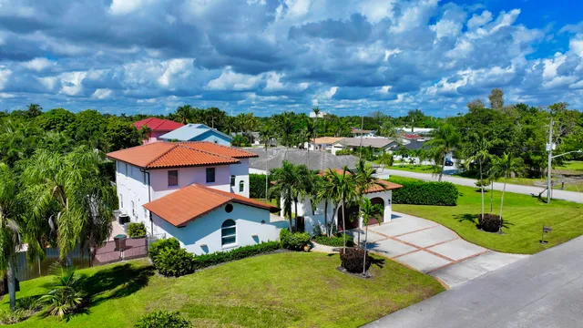 a living room with lots of furniture and a view of dining table