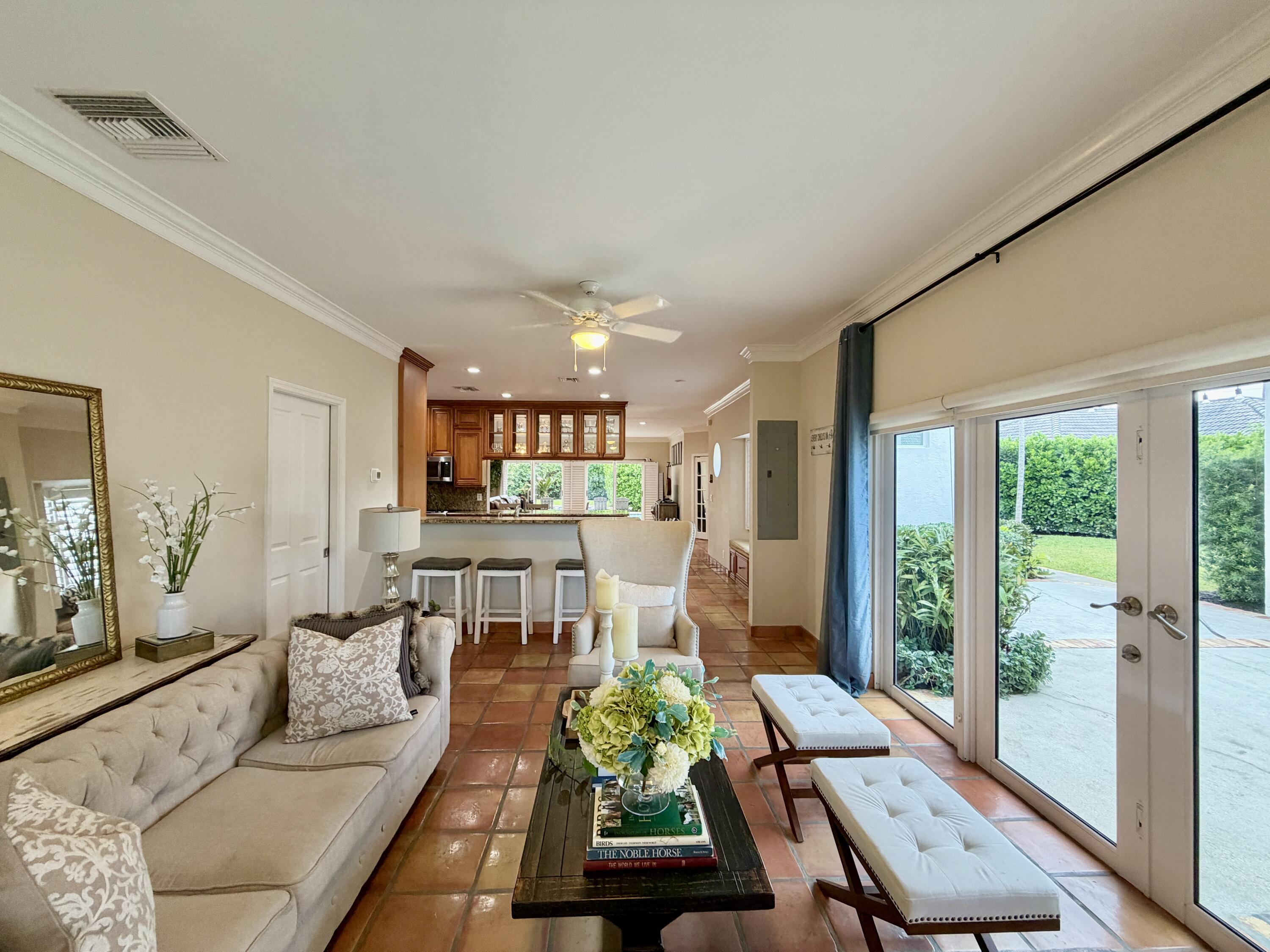 6401 Travis Road West Palm Beach, FL 33406 - Photo 32 of 99 a living room with furniture and a large window
