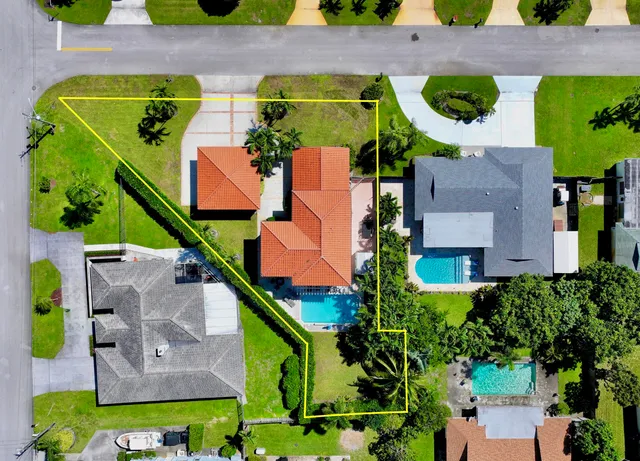 a living room with furniture a dining table and a large window