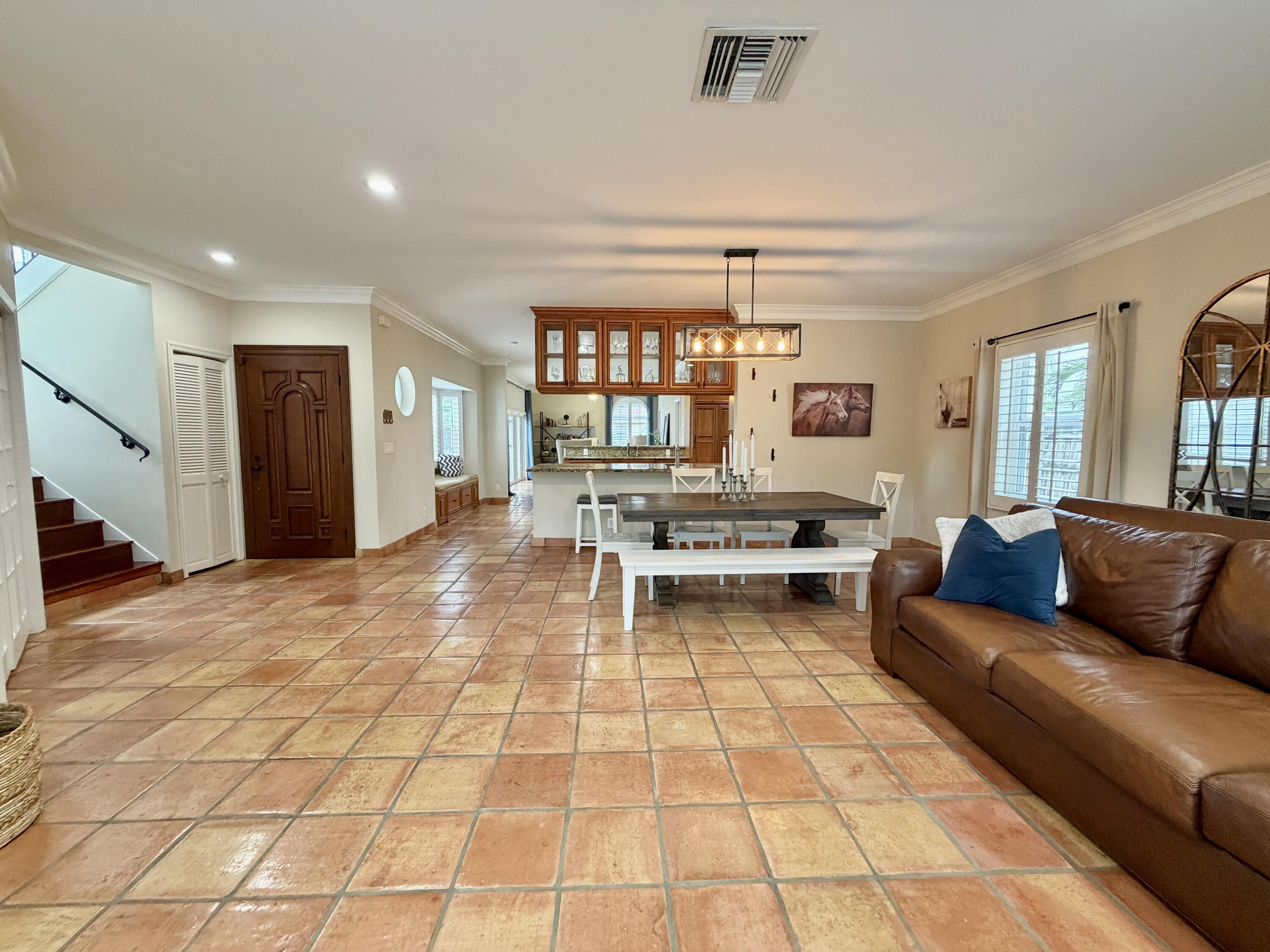 6401 Travis Road West Palm Beach, FL 33406 - Photo 42 of 99 a living room with furniture and a dining table