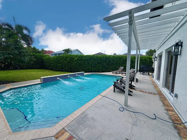 an aerial view of a house with a garden
