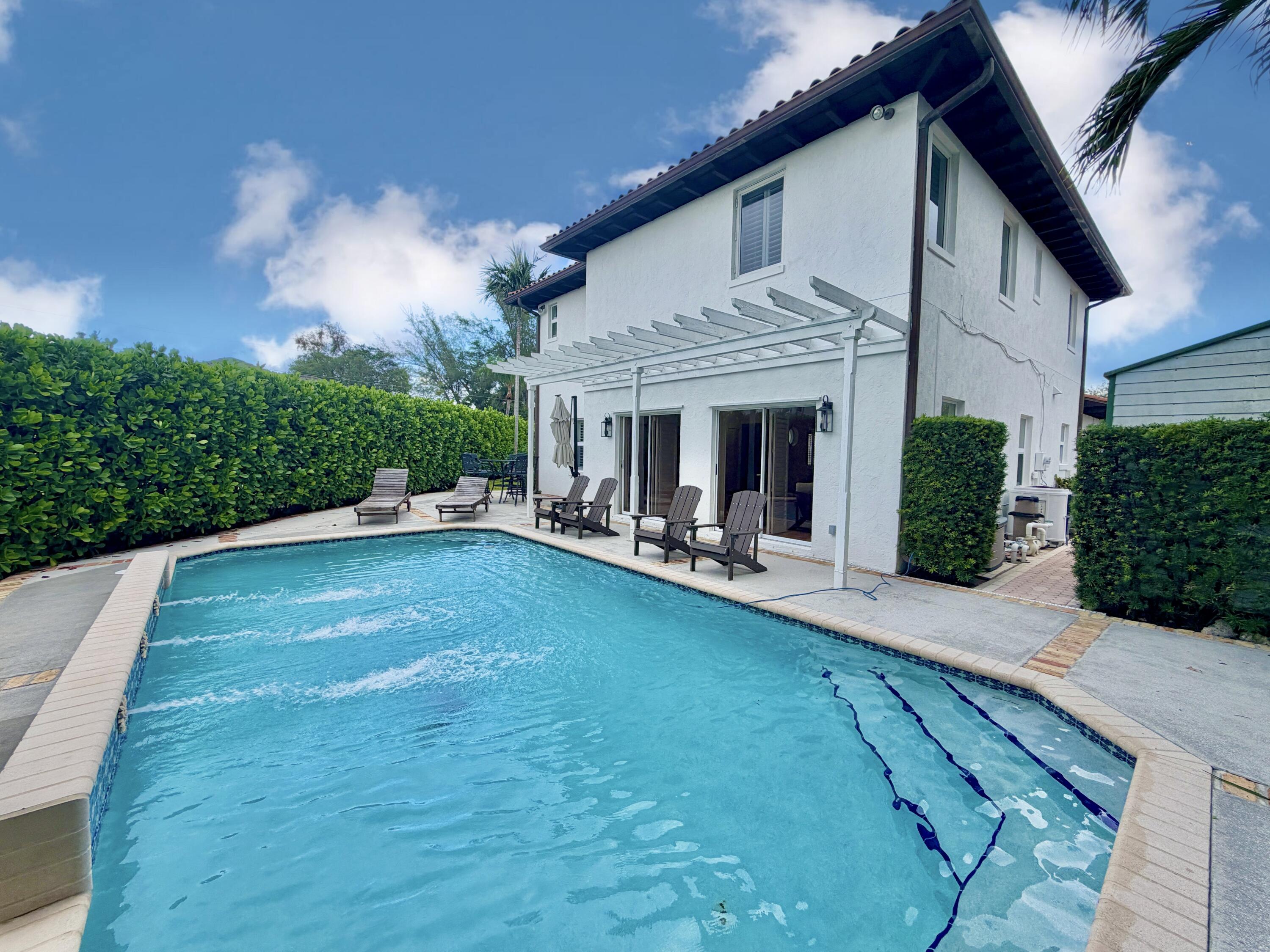 6401 Travis Road West Palm Beach, FL 33406 - Photo 46 of 99 a view of an house with backyard and porch