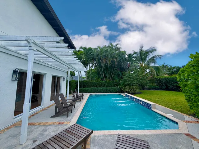 an aerial view of residential house with outdoor space and parking