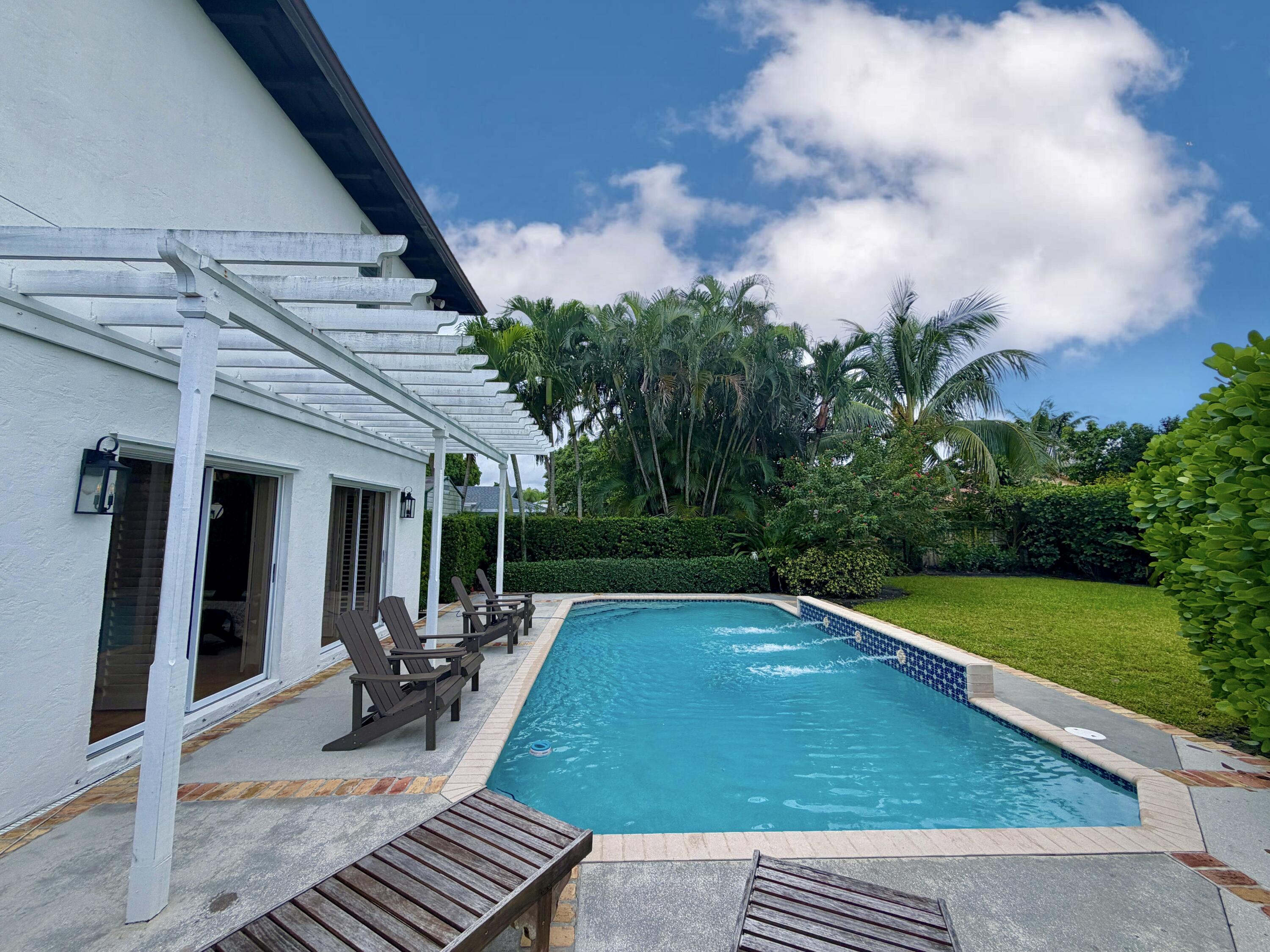 6401 Travis Road West Palm Beach, FL 33406 - Photo 48 of 99 a view of outdoor space yard deck and patio