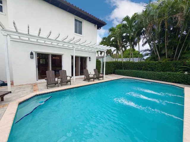 an aerial view of residential houses with outdoor space and street view