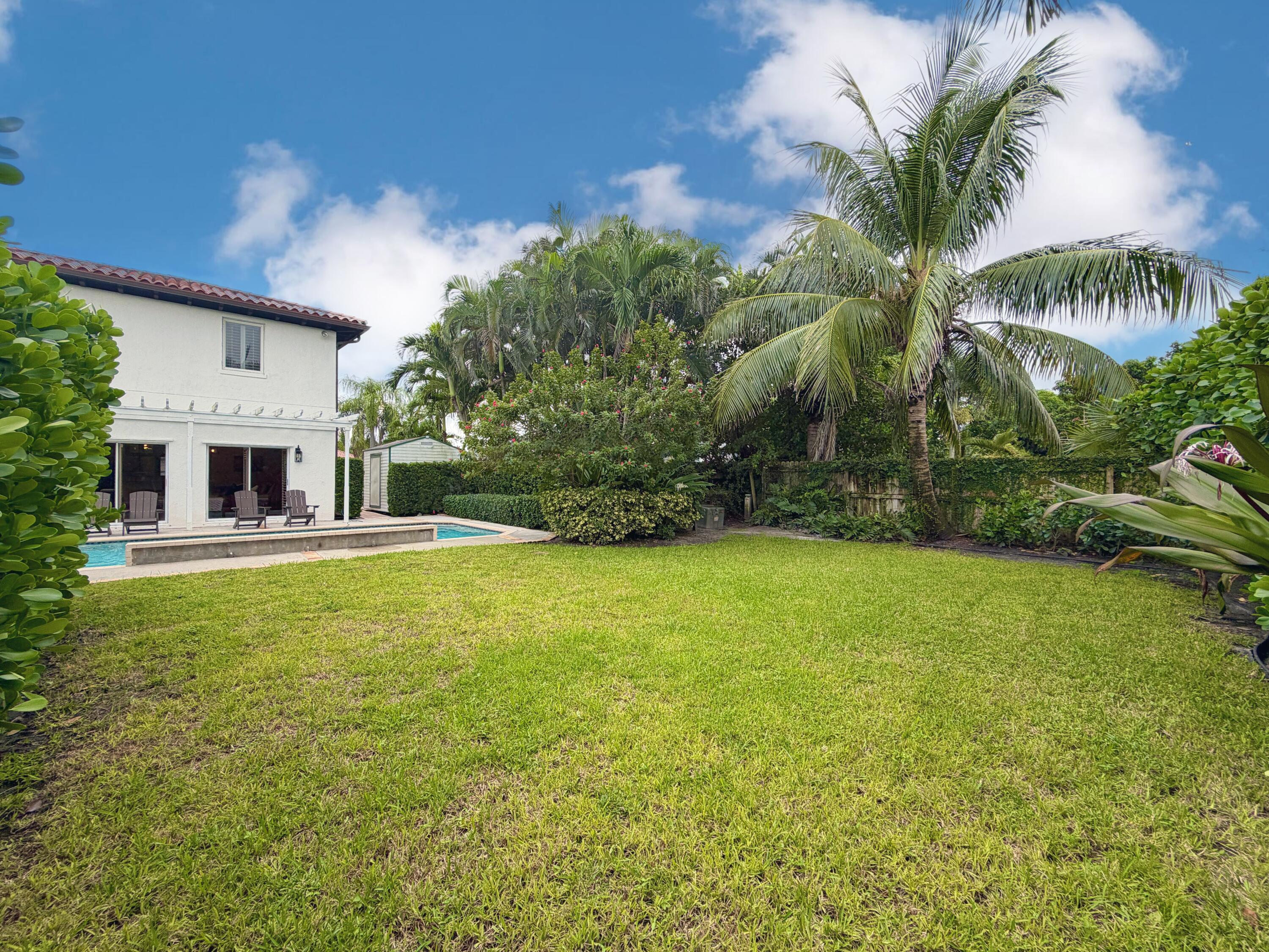 6401 Travis Road West Palm Beach, FL 33406 - Photo 52 of 99 a house with swimming pool