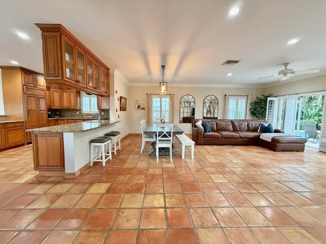a view of a dining room with furniture window and outside view
