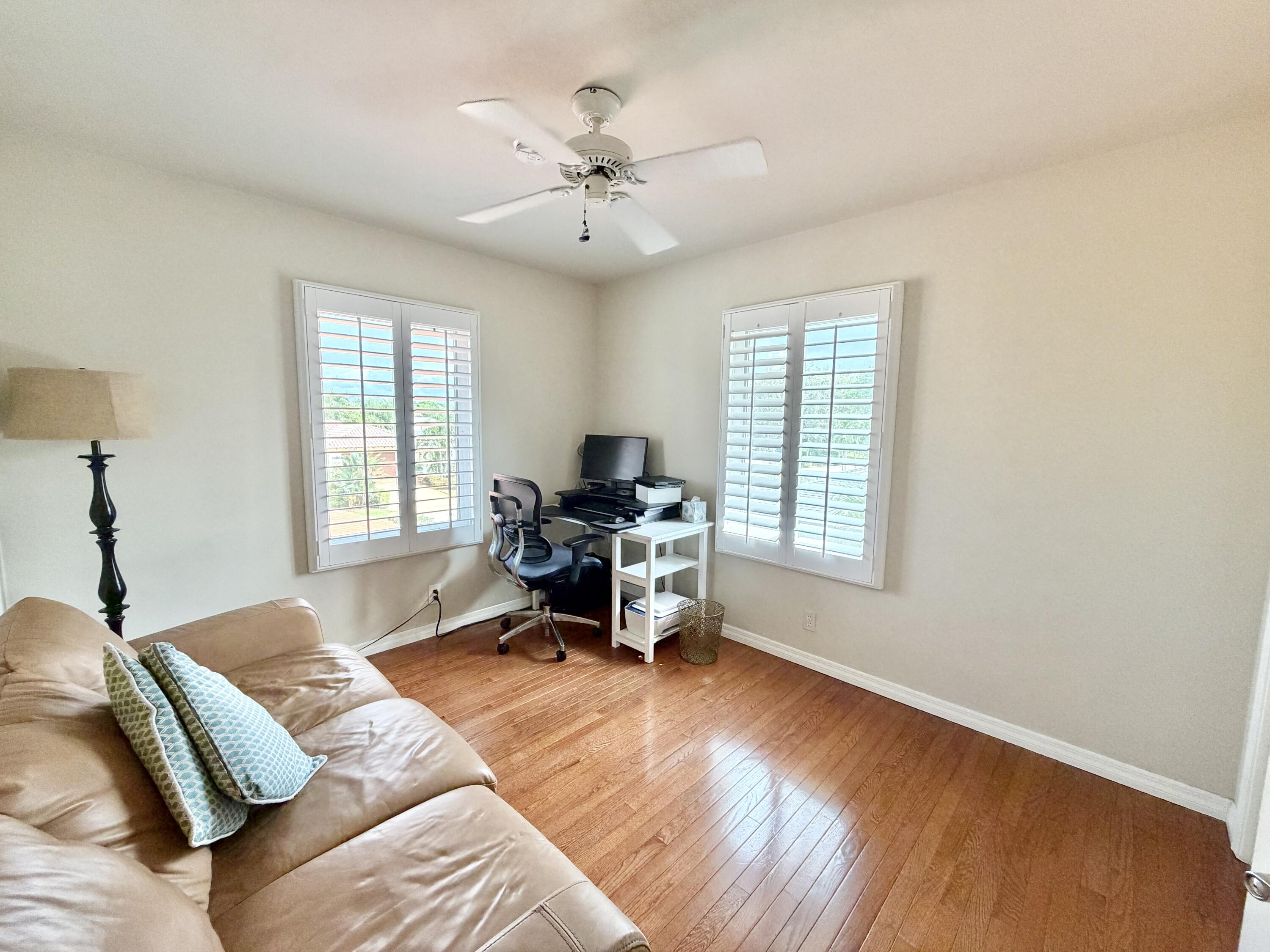 6401 Travis Road West Palm Beach, FL 33406 - Photo 83 of 99 a bed room with a bed and a chair