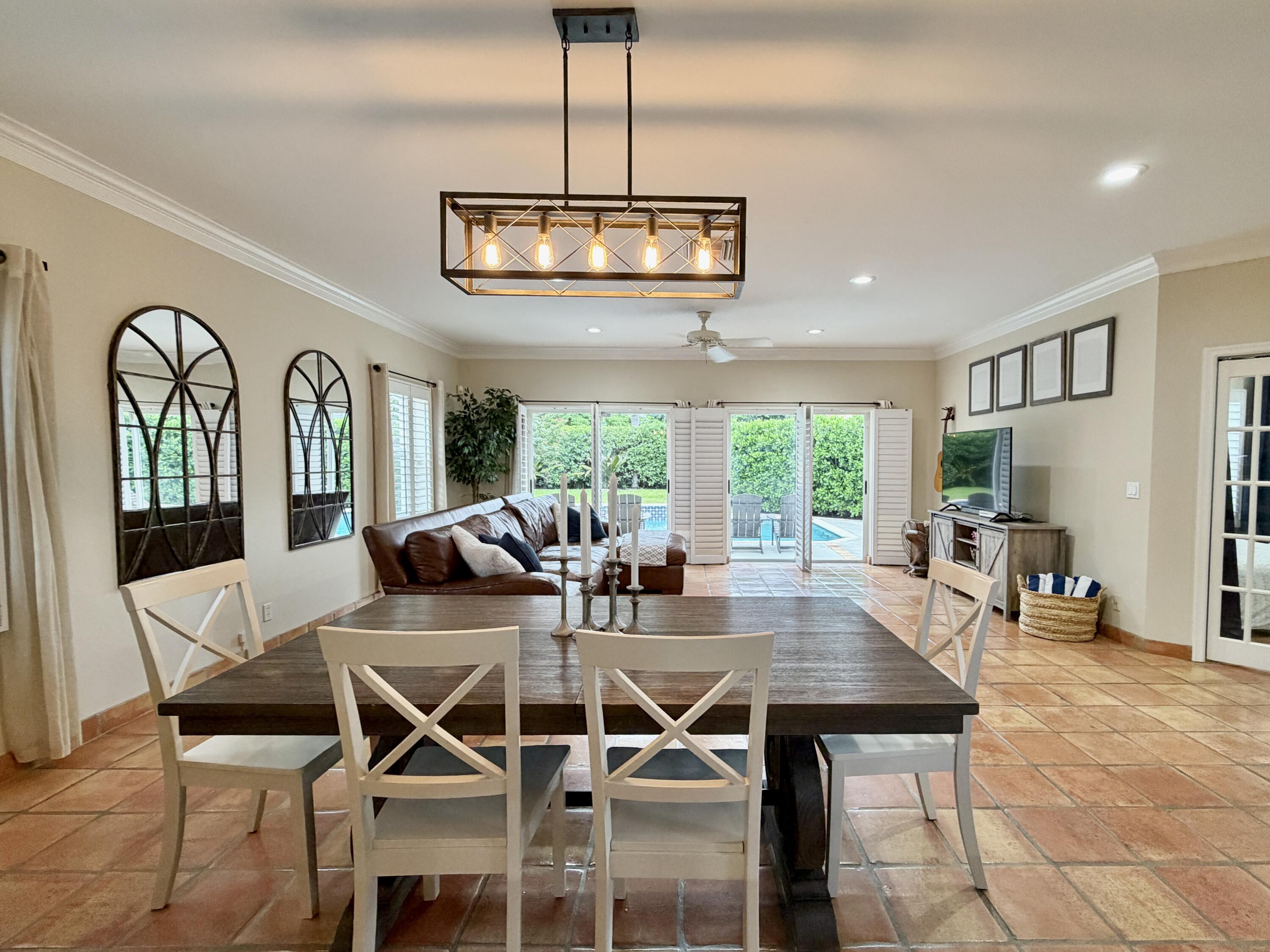 6401 Travis Road West Palm Beach, FL 33406 - Photo 10 of 99 a view of a dining room with furniture window and outside view