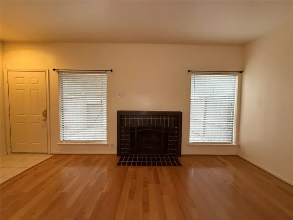 a view of a livingroom with wooden floor