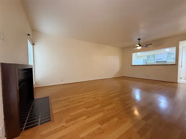 a large kitchen with stainless steel appliances granite countertop a stove a sink and a granite counter tops