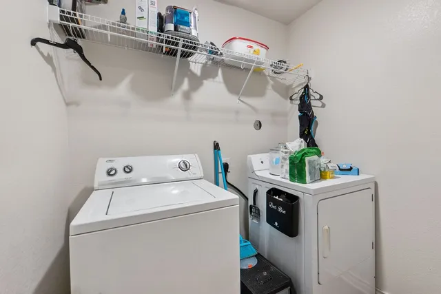 a view of a backyard with wooden fence