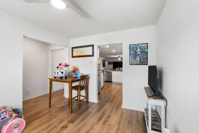 a view of a livingroom with furniture and a workspace