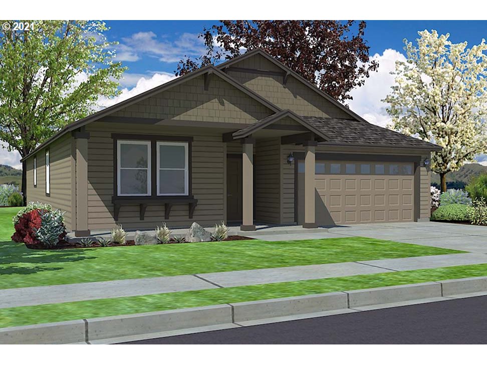 715 South 52nd Street Springfield, OR 97478 - Photo 1 of 11 a small white house with a yard plants and big trees