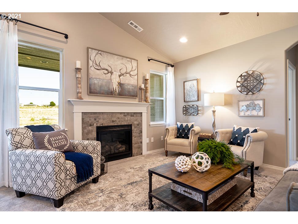 715 South 52nd Street Springfield, OR 97478 - Photo 6 of 11 a living room with furniture and a fireplace