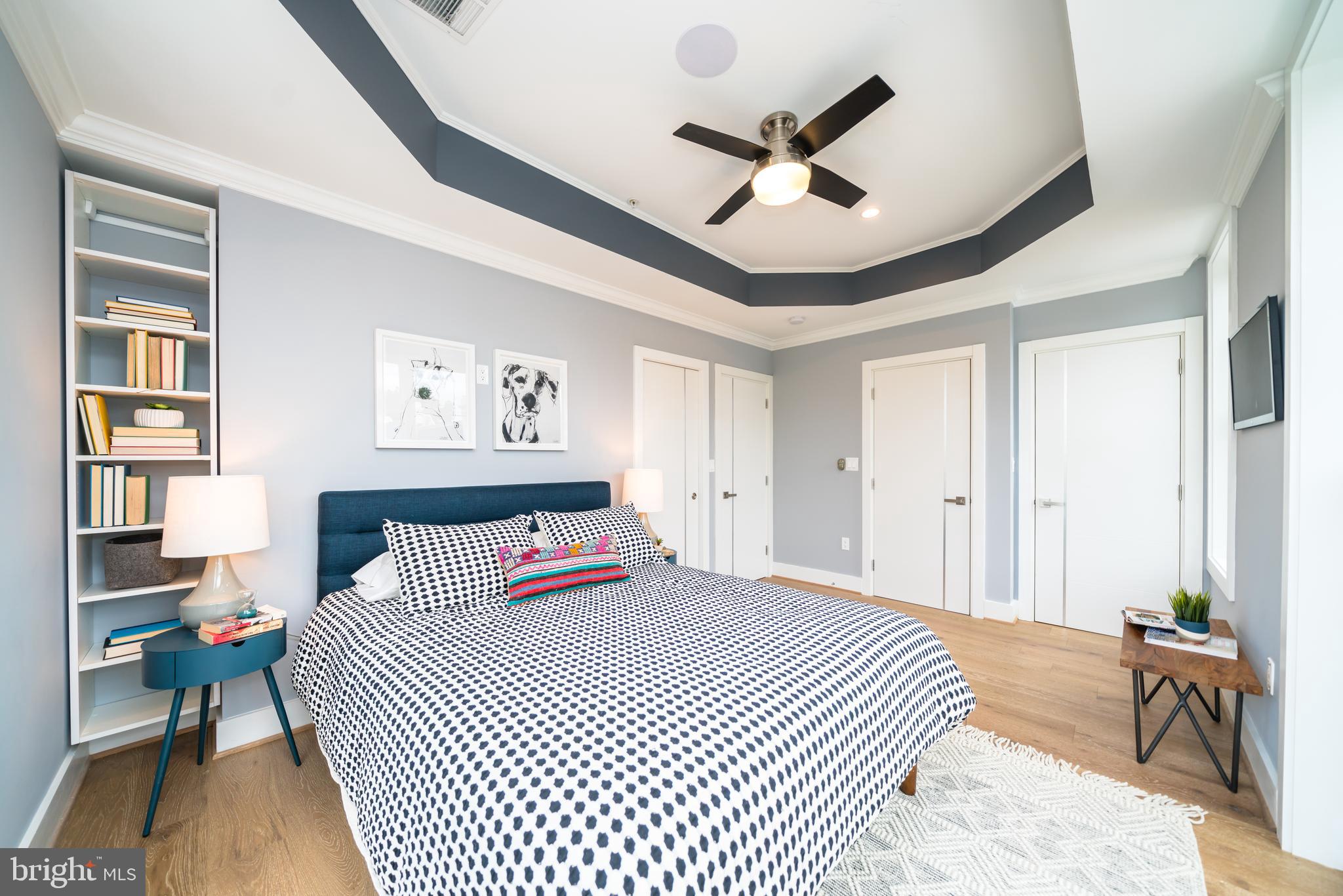 433 Park Road Northwest, Unit 2 Washington, DC 20010 - Photo 35 of 52 Built-In Shelving, Tray Ceiling with ceiling fan