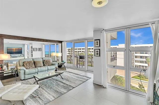 a view of a balcony with chairs