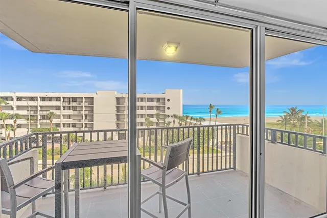 a living room with furniture a dining table and chairs