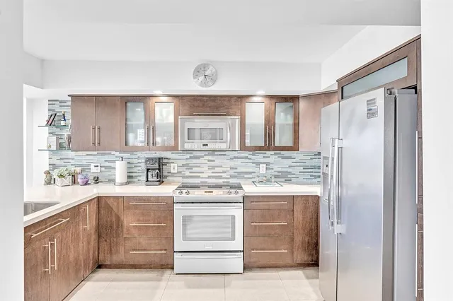 a living room with fireplace furniture and a flat screen tv