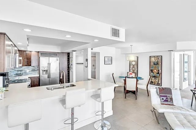 a bathroom with a shower and a sink