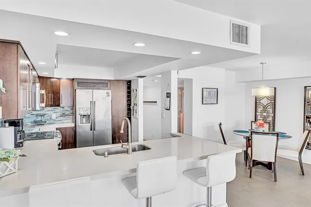 a bedroom with two beds and a large window