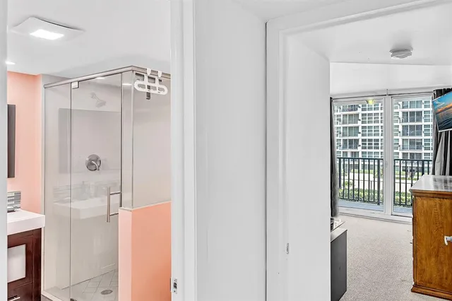a balcony with furniture and a potted plant