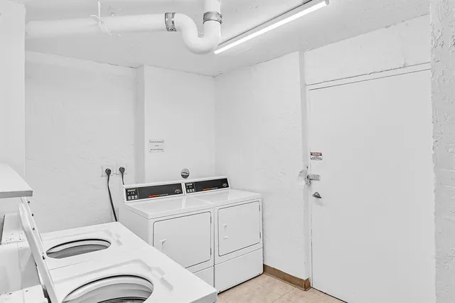 a swimming pool with outdoor seating and plants