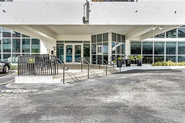 a view of a street with flower garden