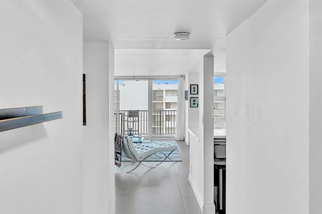 a kitchen with stainless steel appliances kitchen island granite countertop a sink and cabinets