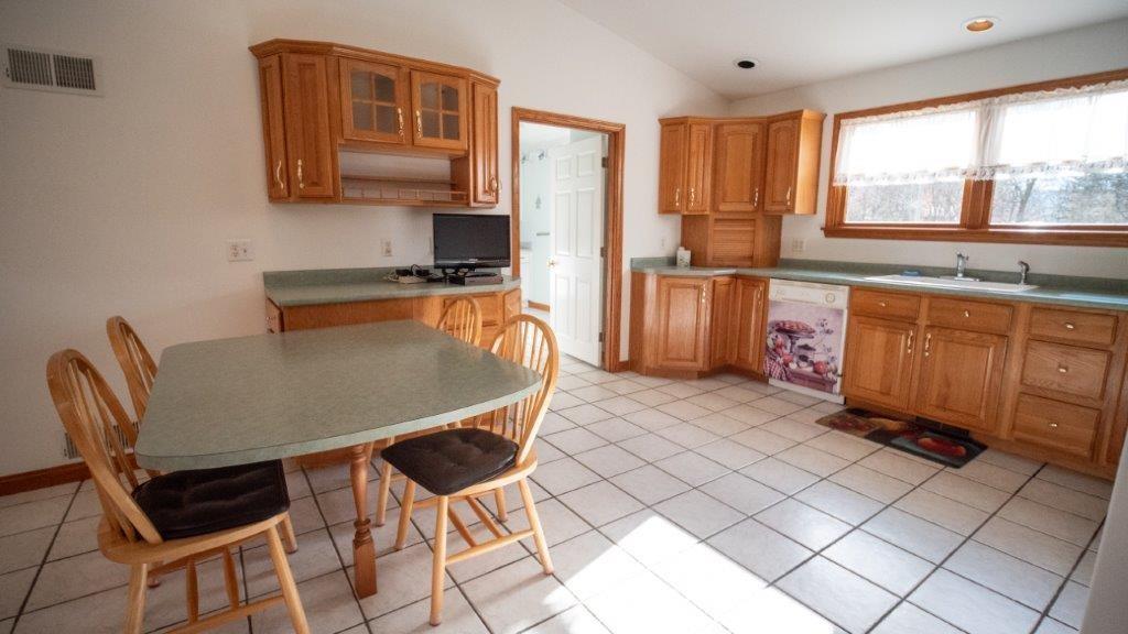 900 Lardintown Road Tarentum, PA 15084 - Photo 34 of 50 a dining room with a sink a counter top space and a window