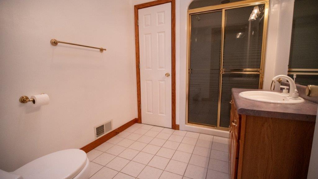 900 Lardintown Road Tarentum, PA 15084 - Photo 41 of 50 a bathroom with a sink a toilet and shower