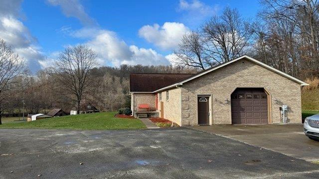 900 Lardintown Road Tarentum, PA 15084 - Photo 6 of 50 a view of a grey house with a yard