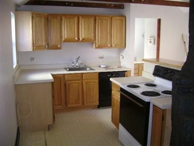 199 High Street Wareham, MA 02571 - Photo 2 of 6 a kitchen with a stove and a sink