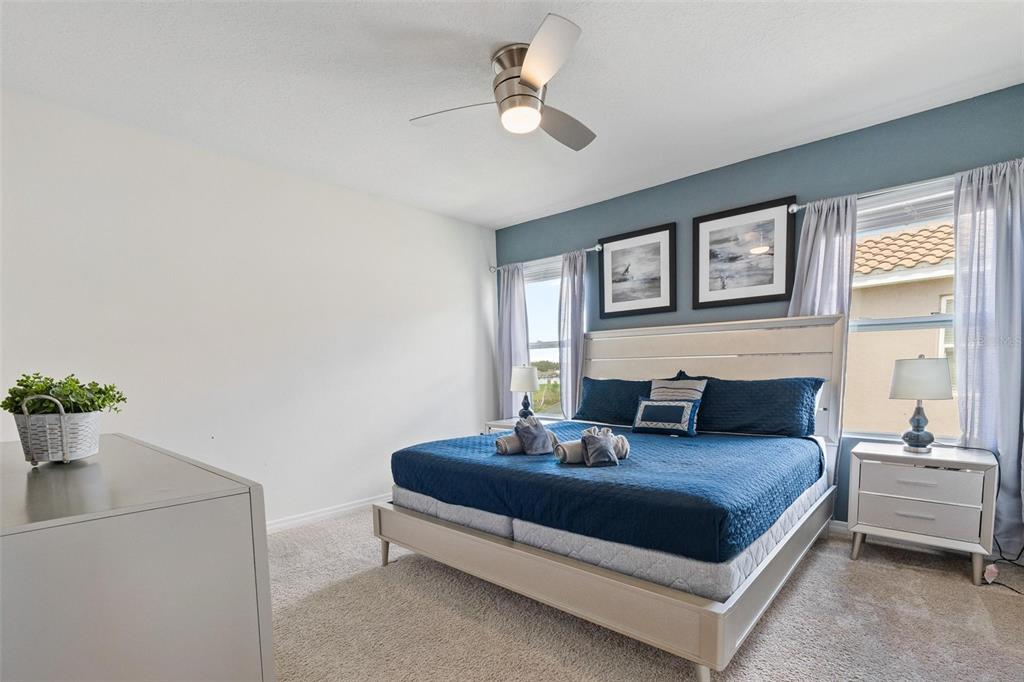 7841 Oak Reflection Loop Davenport, FL 33837 - Photo 17 of 44 a living room with furniture and a chandelier