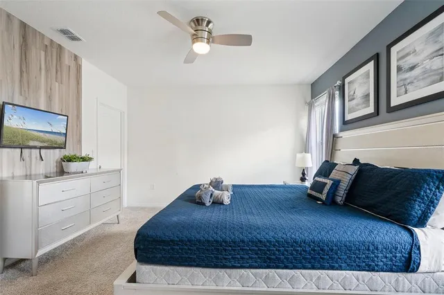 a bedroom with a bed and window