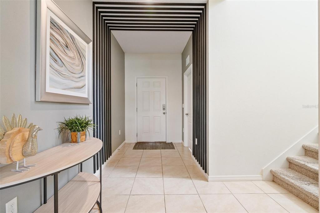 7841 Oak Reflection Loop Davenport, FL 33837 - Photo 35 of 44 a view of entryway with kitchen