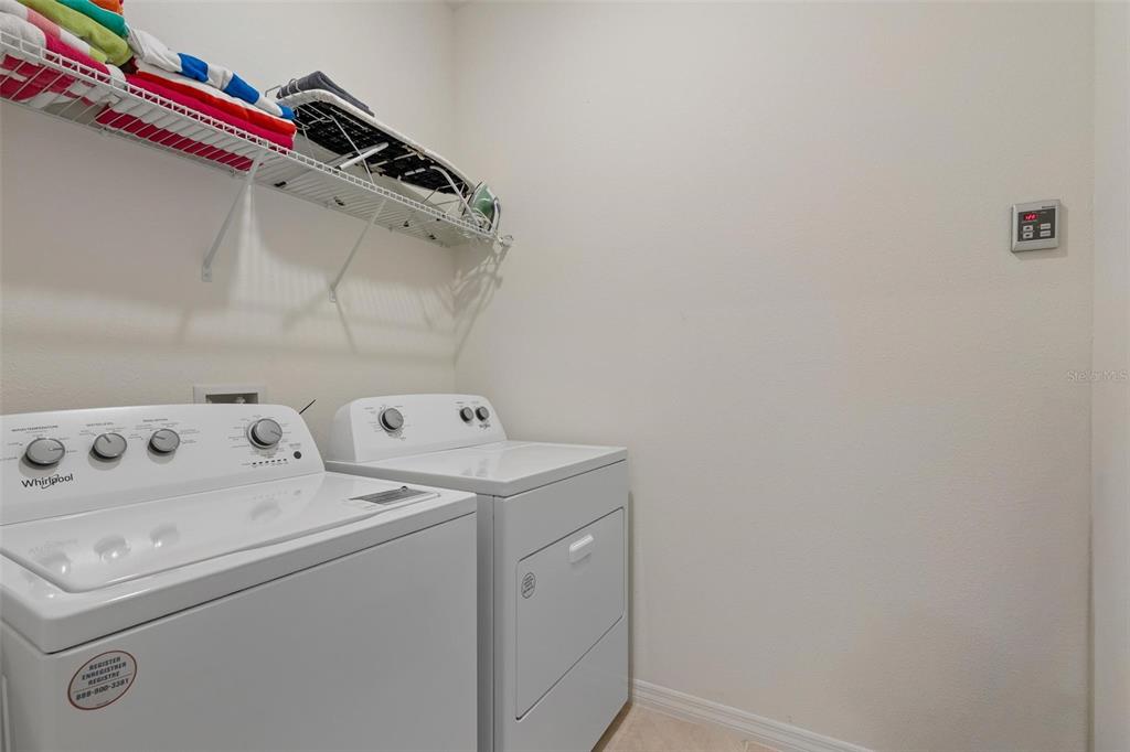 7841 Oak Reflection Loop Davenport, FL 33837 - Photo 36 of 44 a utility room with dryer and washer