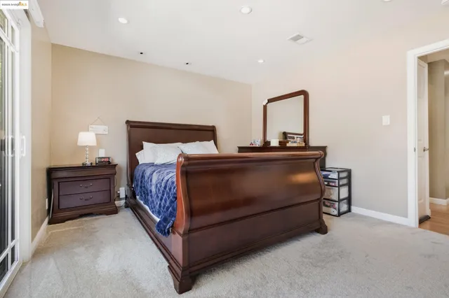 an aerial view of a house with a yard basket ball court and outdoor seating