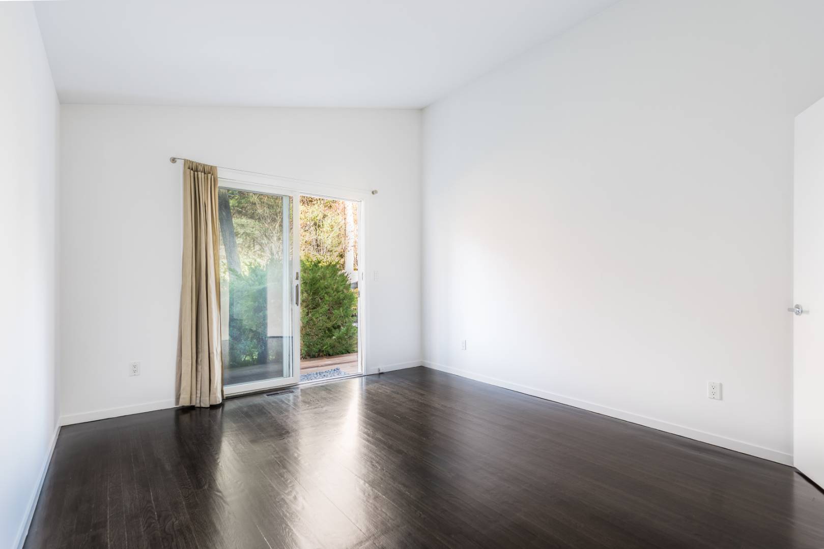 132 Springy Banks Road East Hampton, NY 11937 - Photo 21 of 37 an empty room with wooden floor and windows